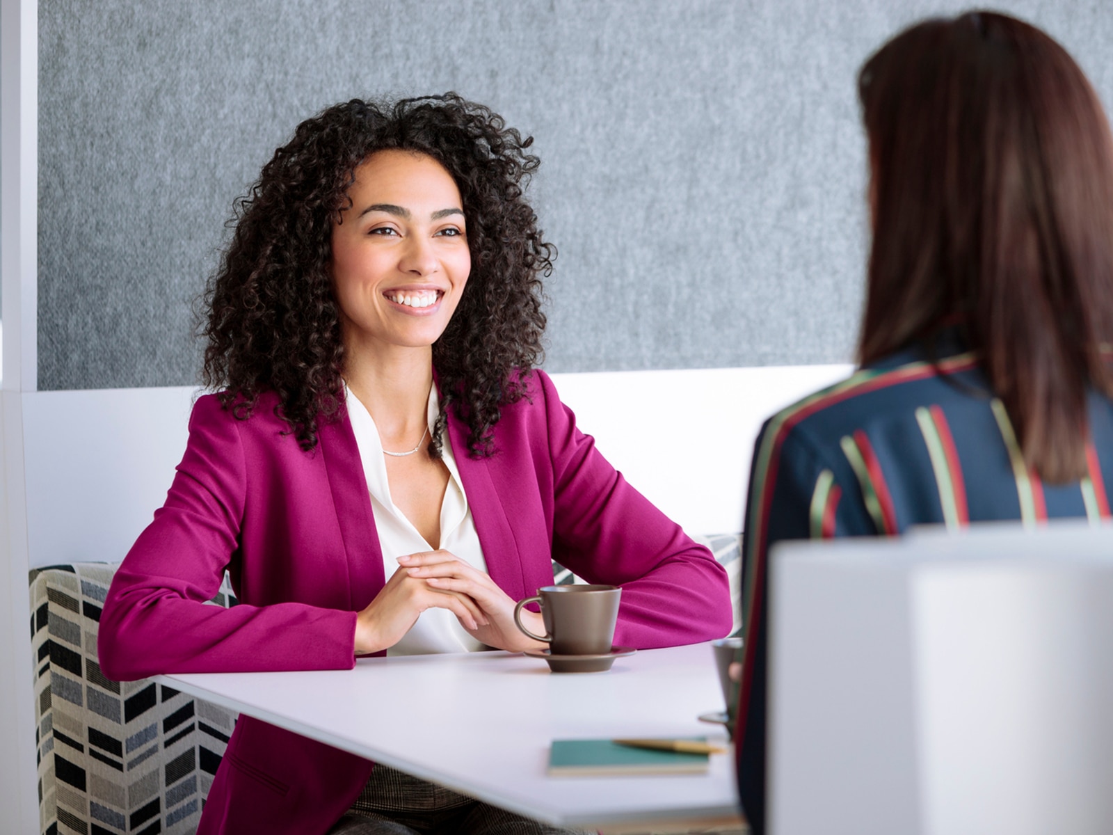 Two women meeting in an office cafe