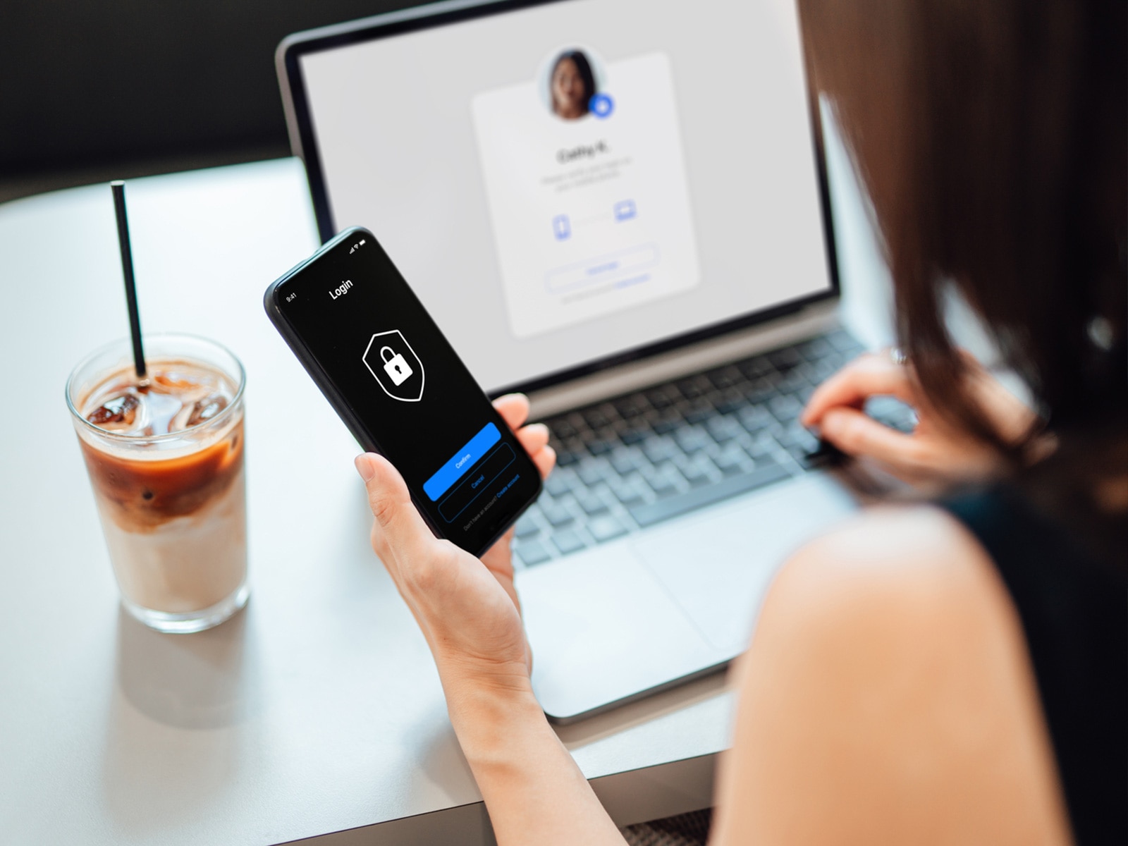 A woman securely logging into her phone.