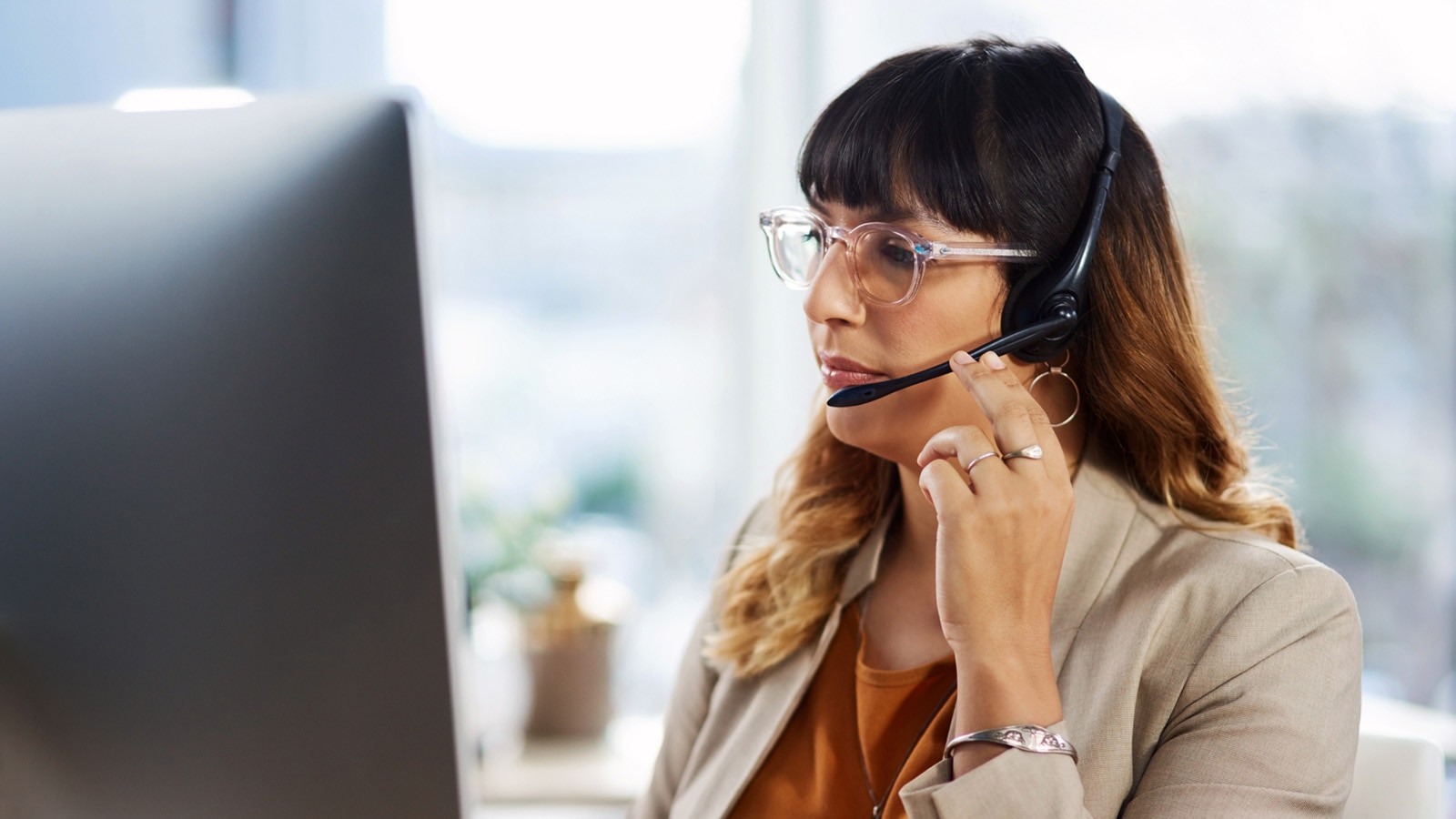 Computer and call center consultation with customer support and headphones.