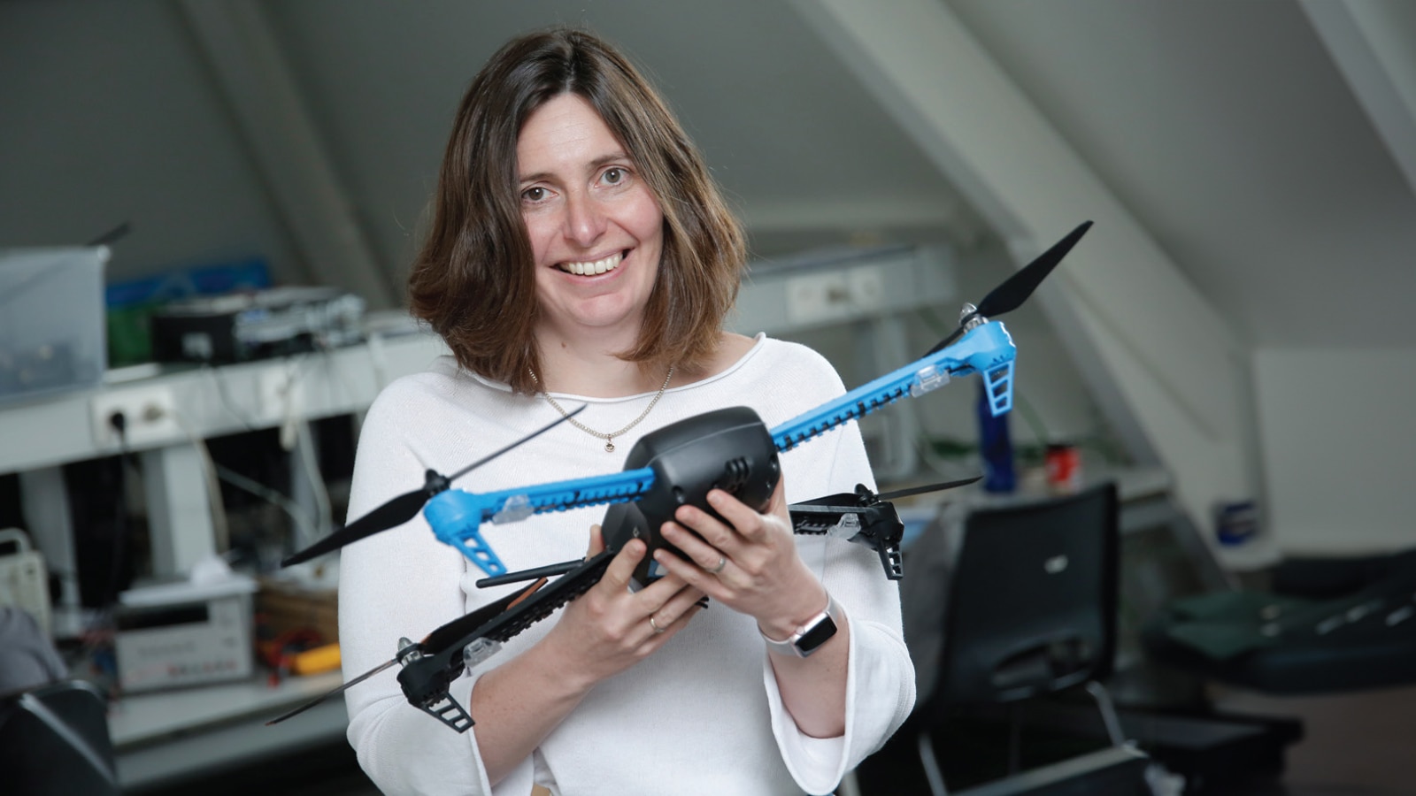 Woman holding drone.